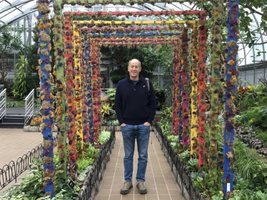 Mike in a tunnel of flowers